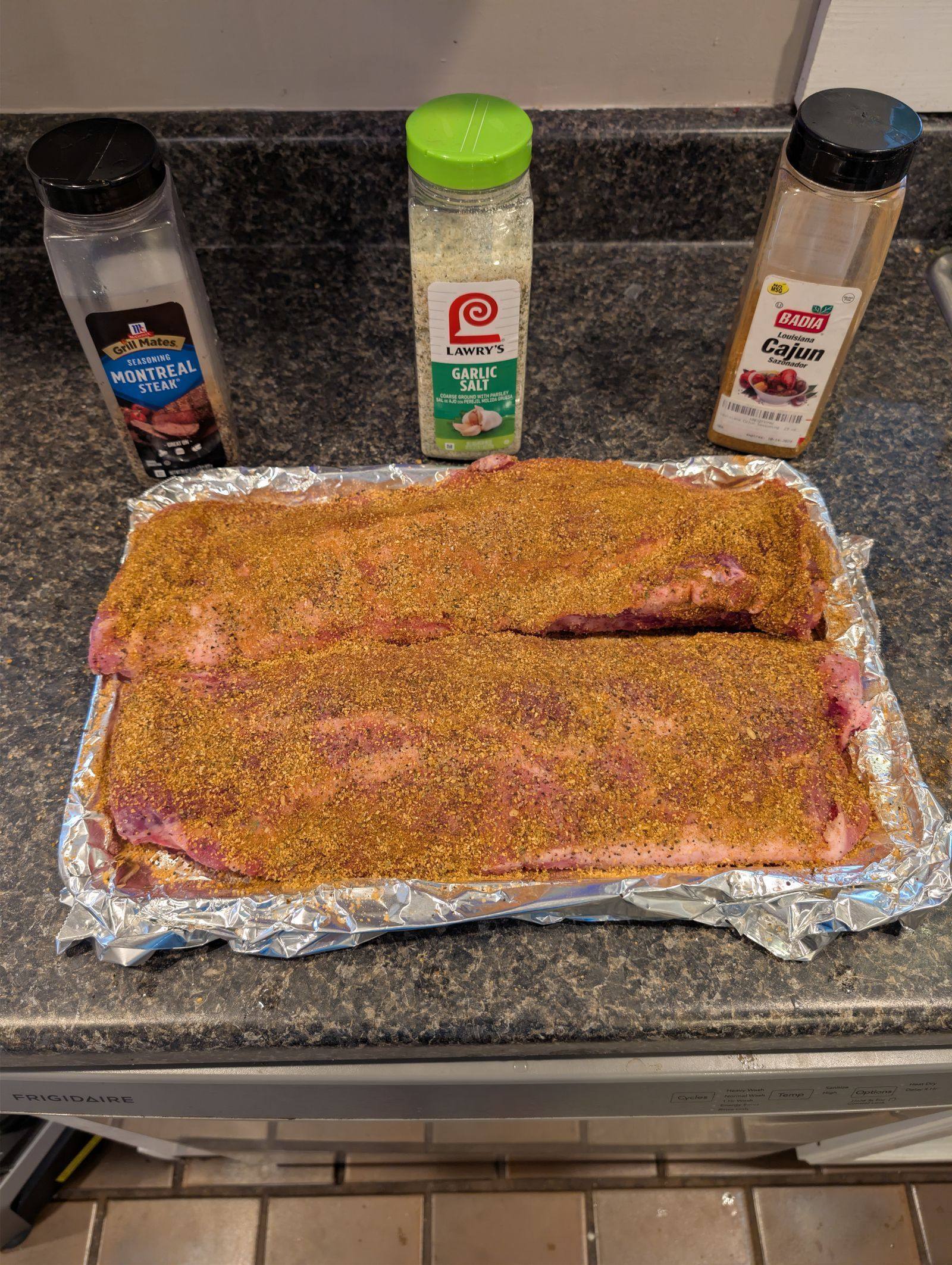 Ribs coated with McCormick Montreal Steak Badia Cajun and Lawrys Garlic Salt