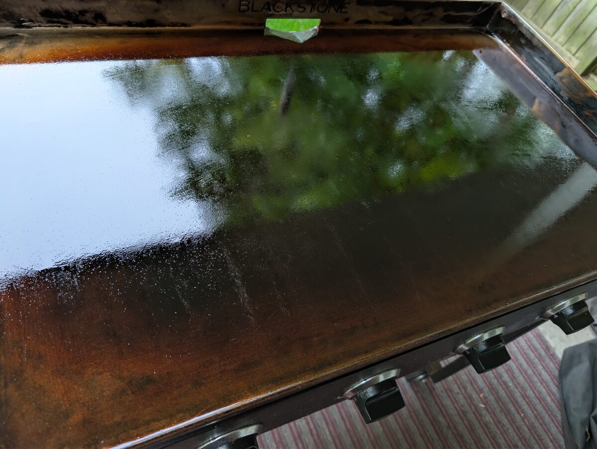 Full view of restored Blackstone griddle after re-seasoning is complete